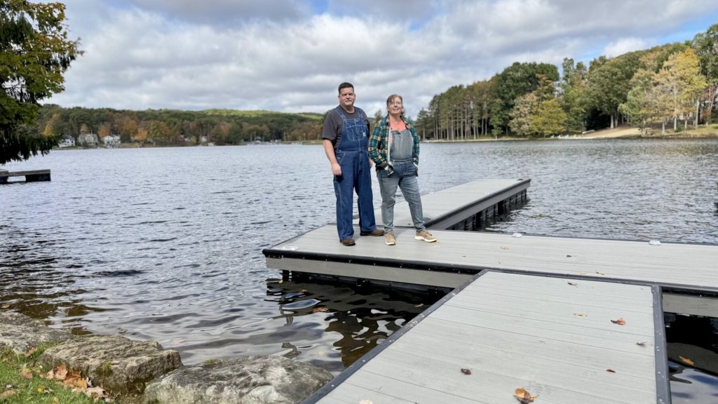 Corey and his sister Corilee standing on the dock with the lake behind them