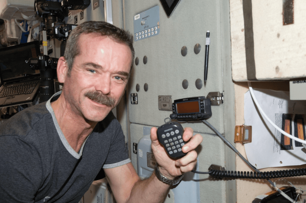 Canadian Space Agency astronaut Chris Hadfield aboard the International Space Station, using the station's ham radio during a session with students