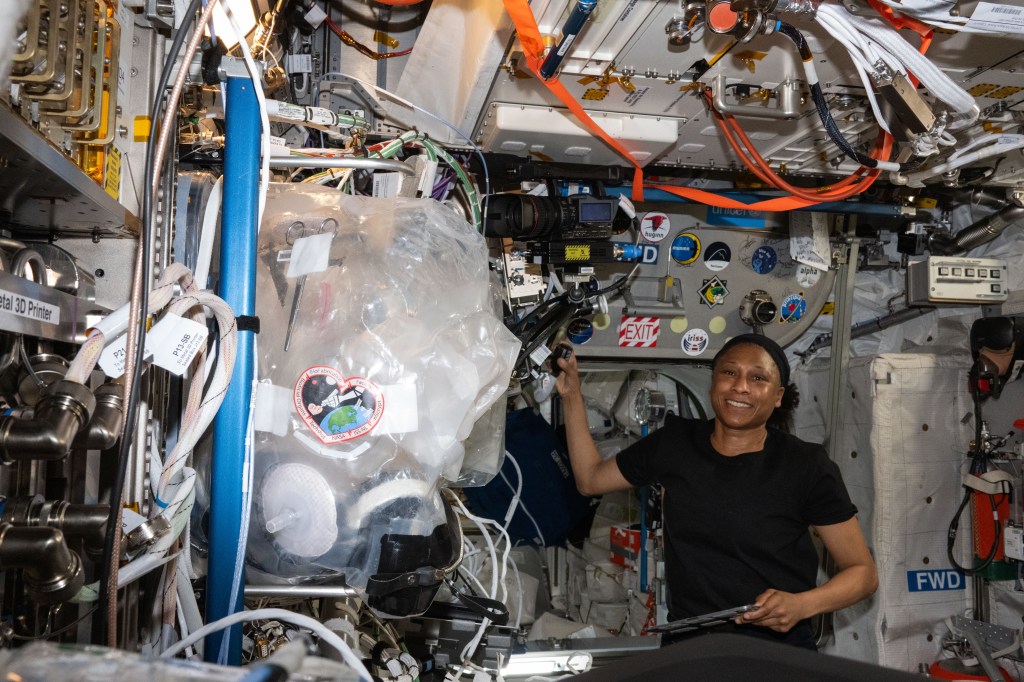 NASA astronaut Jeanette Epps in the Columbus module of the International Space Station after a ham radio session with students